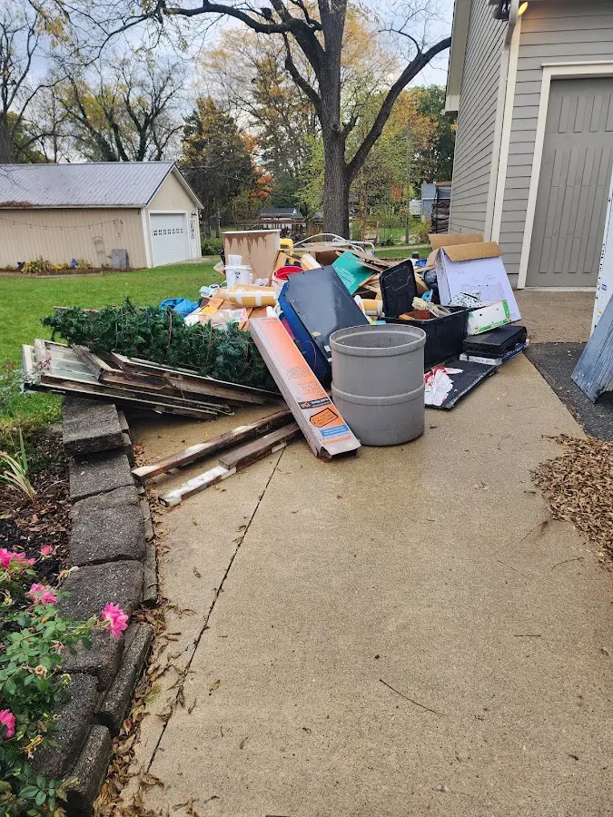 Dumpster being loaded with debris for Estate Cleanout Dumpster Rental in Ellicott